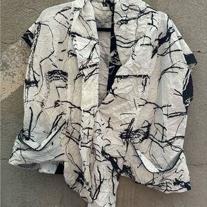 Kozan vest. Black and white. Would fit to size large. 23” armpit to armpit.